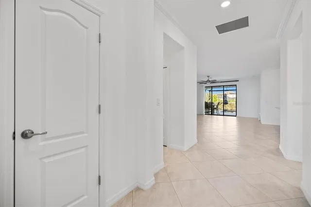 a view of a glass door with a yard from the hallway