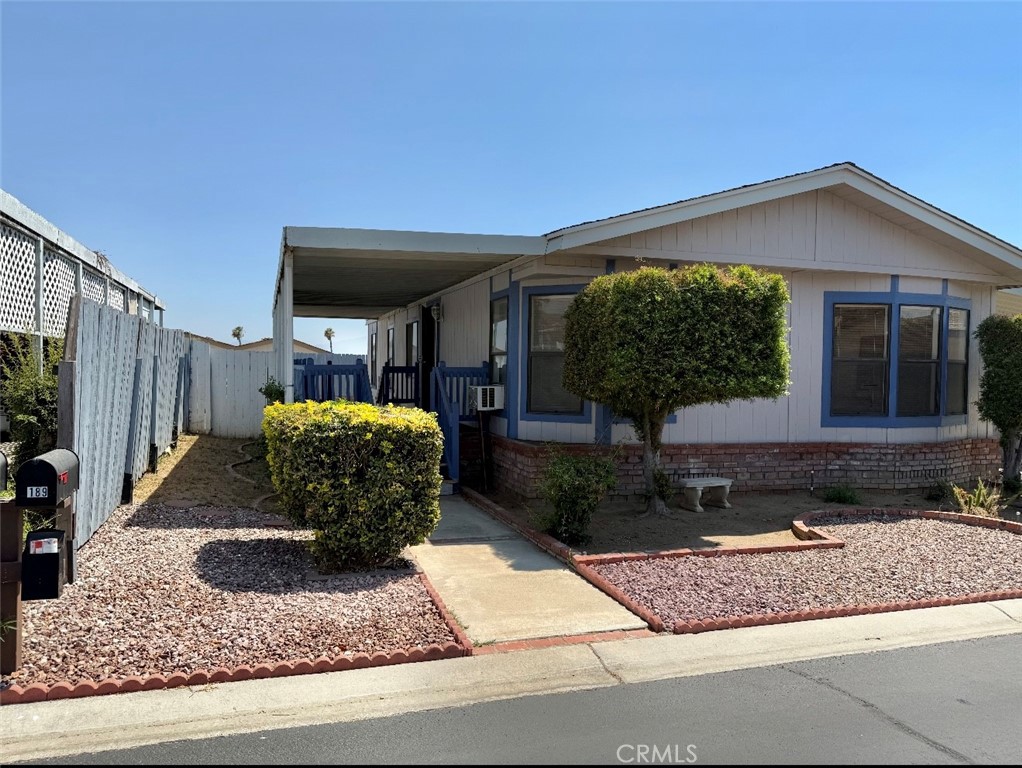 4080 Pedley Road, Unit 189 Jurupa Valley, CA 92509 - Photo 1 of 16 a front view of a house with garden