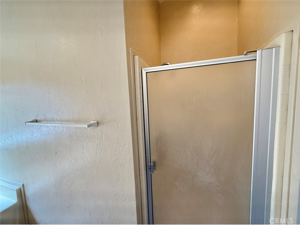 4080 Pedley Road, Unit 189 Jurupa Valley, CA 92509 - Photo 12 of 16 a bathroom with a glass shower door