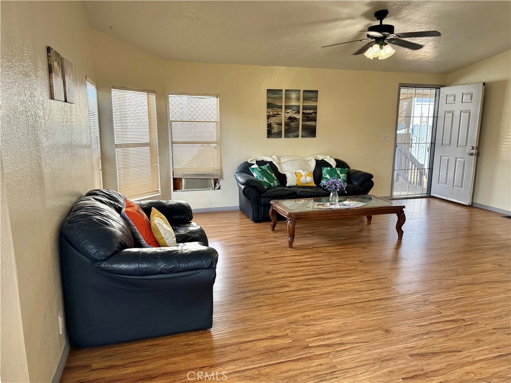 4080 Pedley Road, Unit 189 Jurupa Valley, CA 92509 - Photo 2 of 16 a living room with furniture wooden floor and a large window