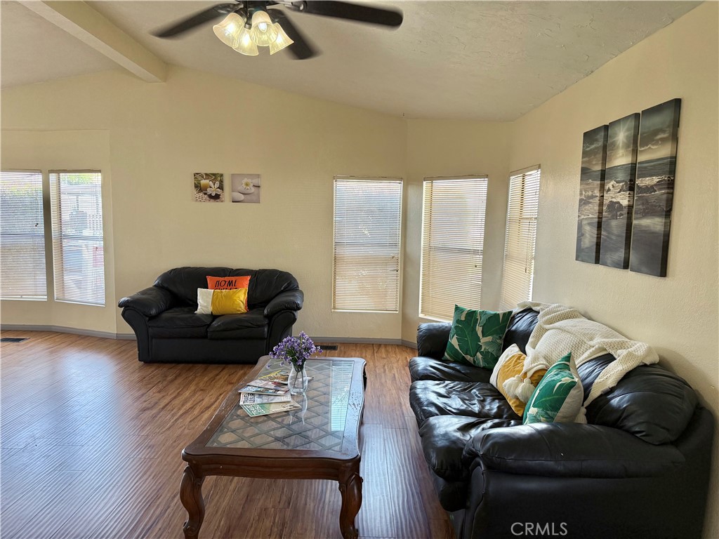 4080 Pedley Road, Unit 189 Jurupa Valley, CA 92509 - Photo 3 of 16 a living room with furniture and a flat screen tv