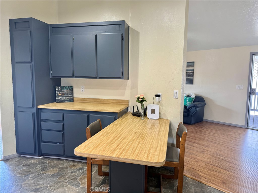 4080 Pedley Road, Unit 189 Jurupa Valley, CA 92509 - Photo 6 of 16 a room with wooden floors and wooden cabinets