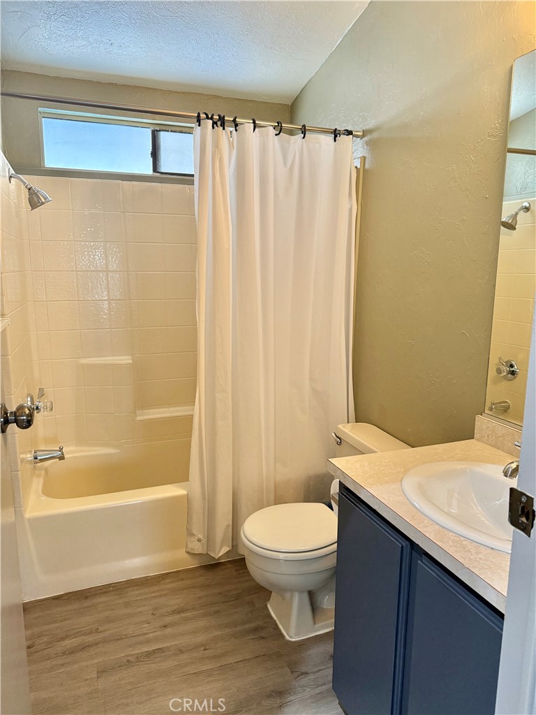 4080 Pedley Road, Unit 189 Jurupa Valley, CA 92509 - Photo 9 of 16 a bathroom with a sink a toilet and shower