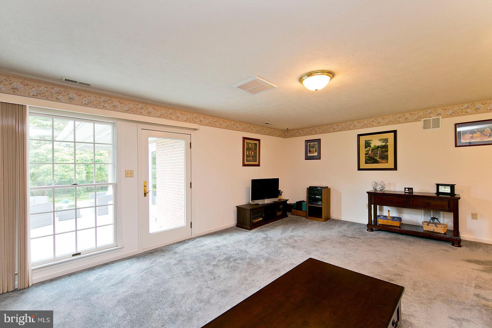 841 Guard Hill Road Middletown, VA 22645 - Photo 20 of 48 Family room with tall windows for natural light
