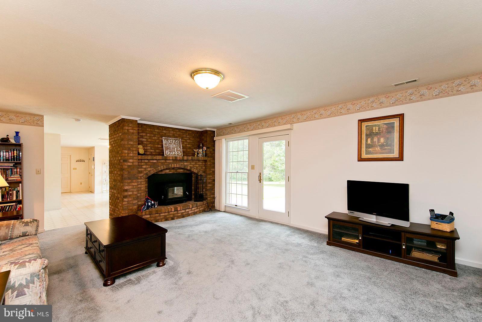 841 Guard Hill Road Middletown, VA 22645 - Photo 22 of 48 Family room with wood burning fireplace