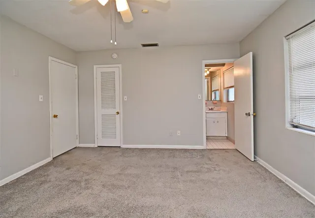 a bathroom with a shower and a toilet