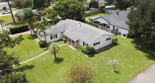 a kitchen with granite countertop a sink and a stove