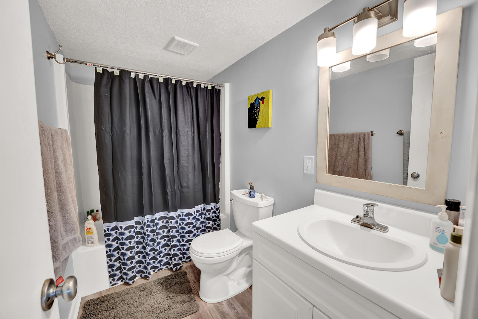 30 Moreno Point Road, Unit 102A Destin, FL 32541 - Photo 14 of 52 a bathroom with a sink a toilet and shower