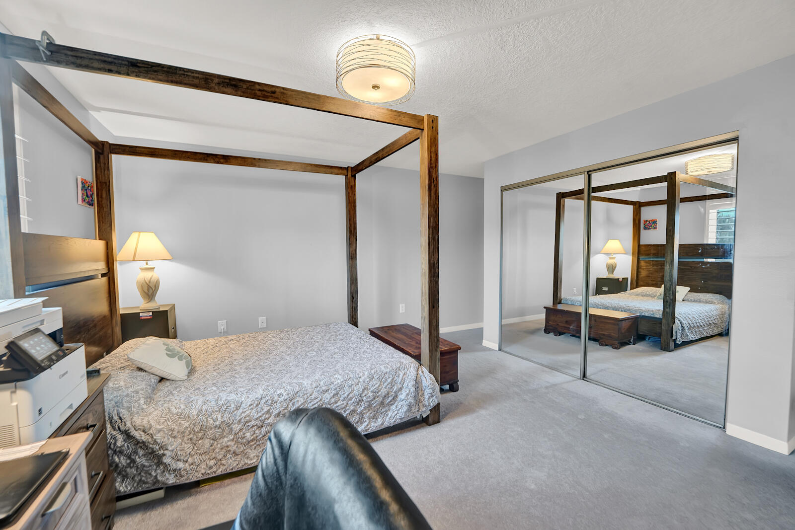 30 Moreno Point Road, Unit 102A Destin, FL 32541 - Photo 15 of 52 a bedroom with a bed and a mirror