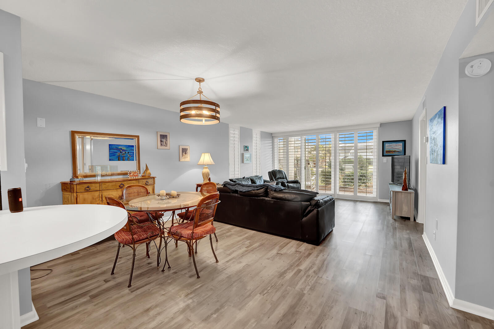 30 Moreno Point Road, Unit 102A Destin, FL 32541 - Photo 20 of 52 a living room with furniture and a chandelier