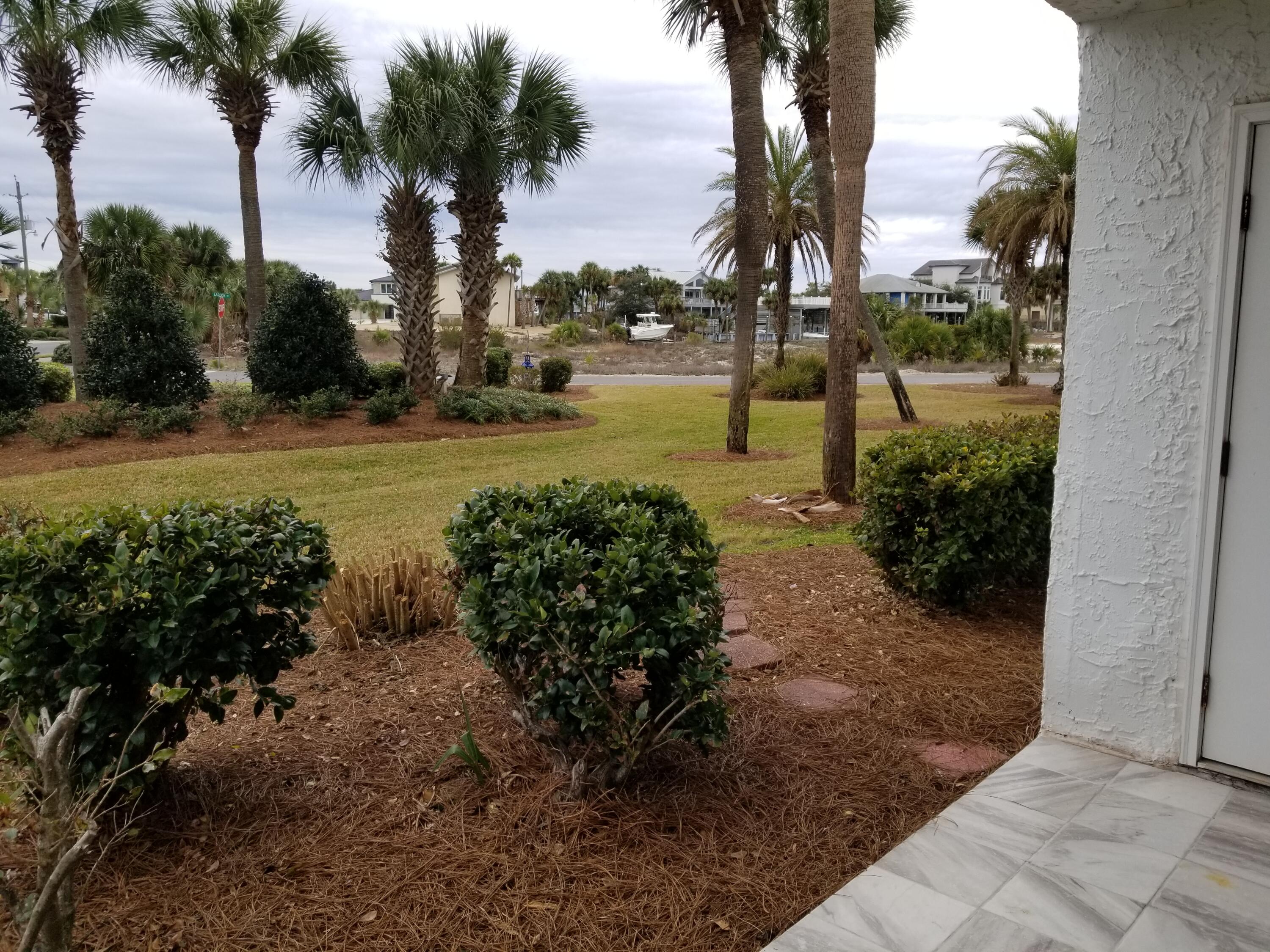 30 Moreno Point Road, Unit 102A Destin, FL 32541 - Photo 23 of 52 a view of a park with palm trees