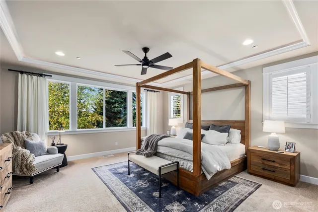 a bedroom with a bed couch and a window