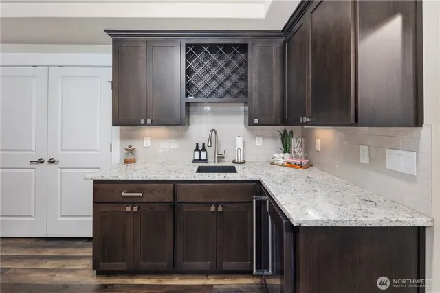 a kitchen with a sink and cabinets