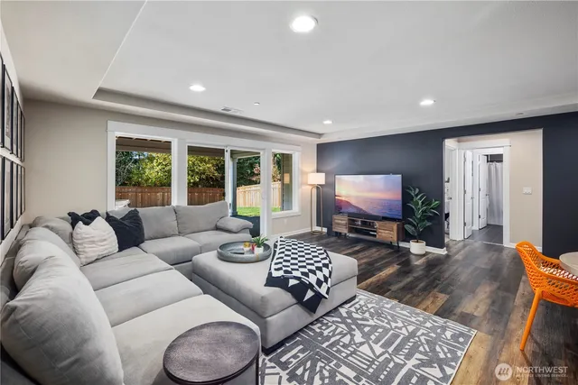 a living room with furniture rug and window