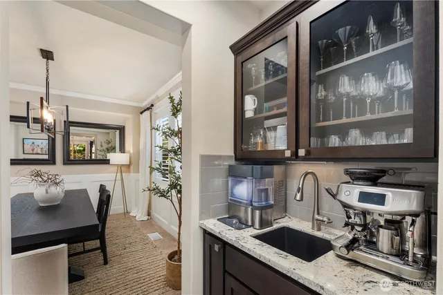 a kitchen with sink and cabinets