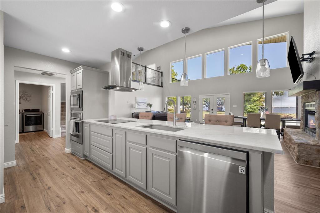 113 Cinch Buckle Ranch Road Trinidad, TX 75163 - Photo 12 of 36 a kitchen with cabinets a sink and appliances