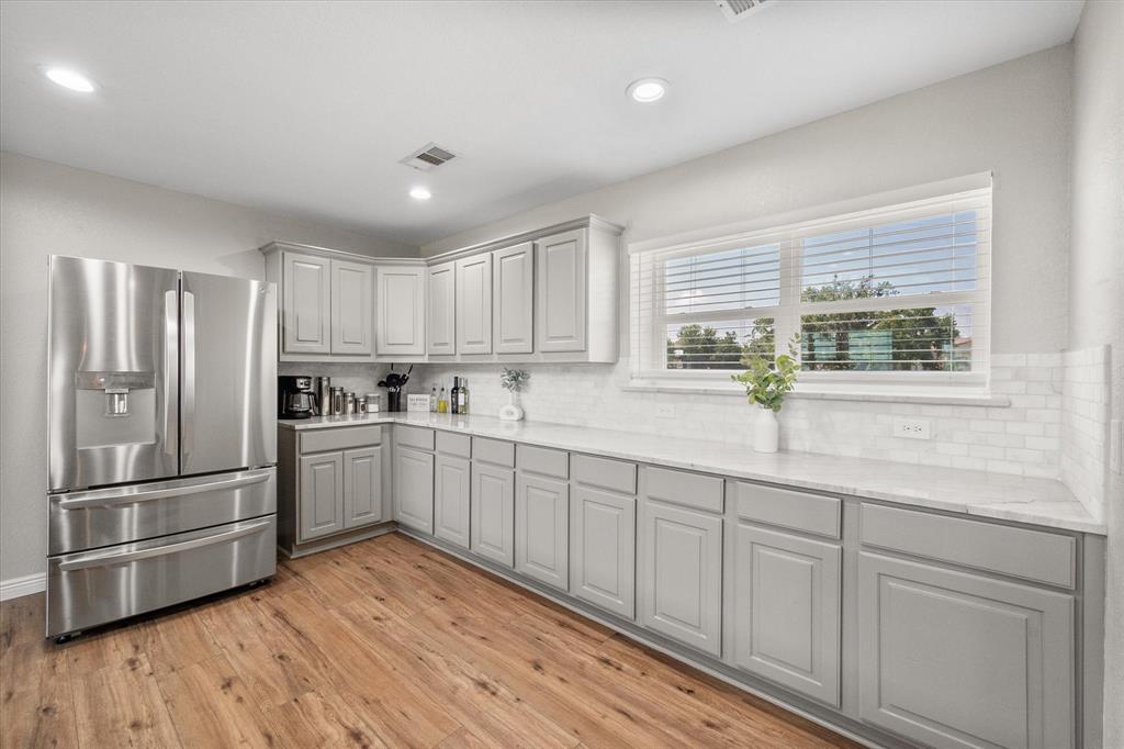 113 Cinch Buckle Ranch Road Trinidad, TX 75163 - Photo 13 of 36 a kitchen with granite countertop a refrigerator sink and cabinets