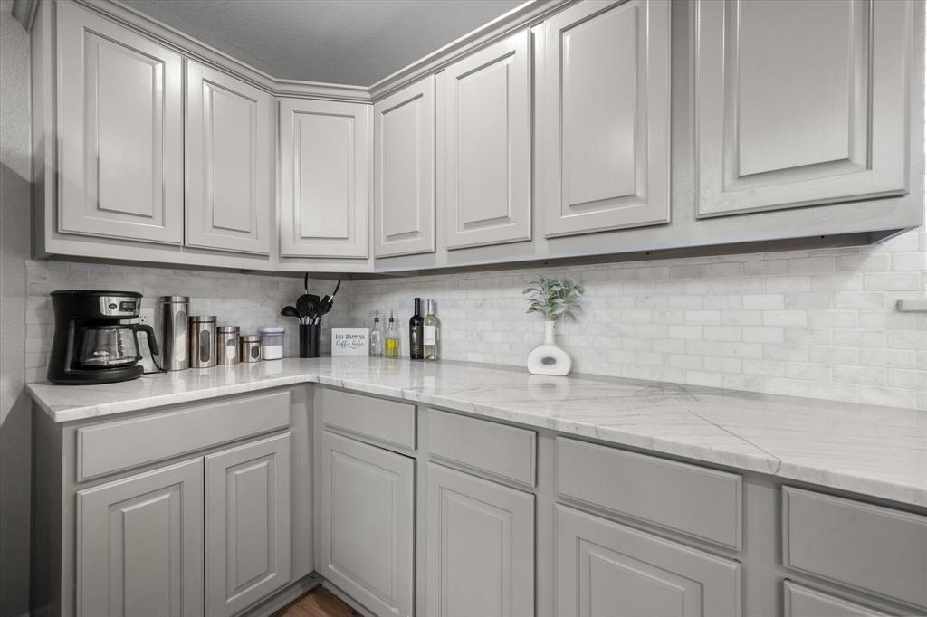 113 Cinch Buckle Ranch Road Trinidad, TX 75163 - Photo 15 of 36 a kitchen with granite countertop white cabinets and sink