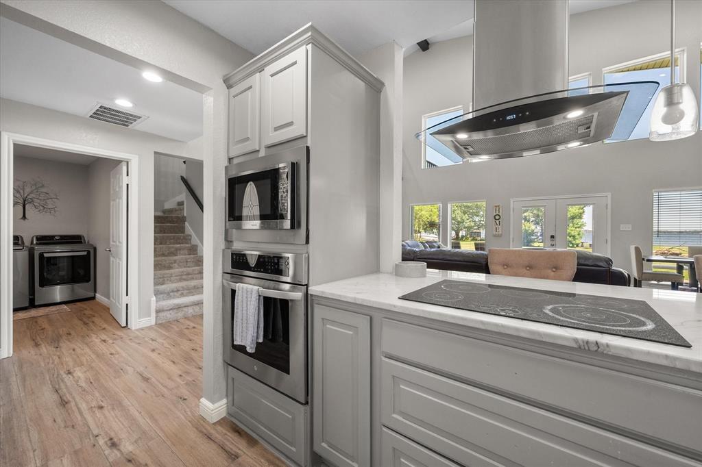 113 Cinch Buckle Ranch Road Trinidad, TX 75163 - Photo 16 of 36 a kitchen with cabinets and stainless steel appliances