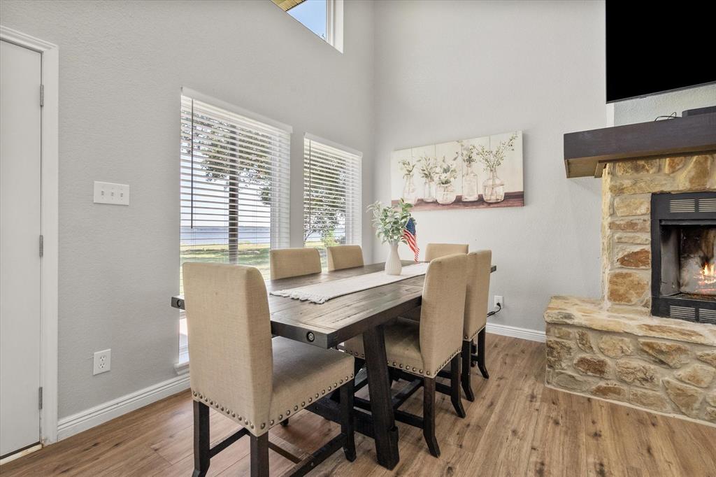 113 Cinch Buckle Ranch Road Trinidad, TX 75163 - Photo 17 of 36 a view of a dining room with furniture window and wooden floor