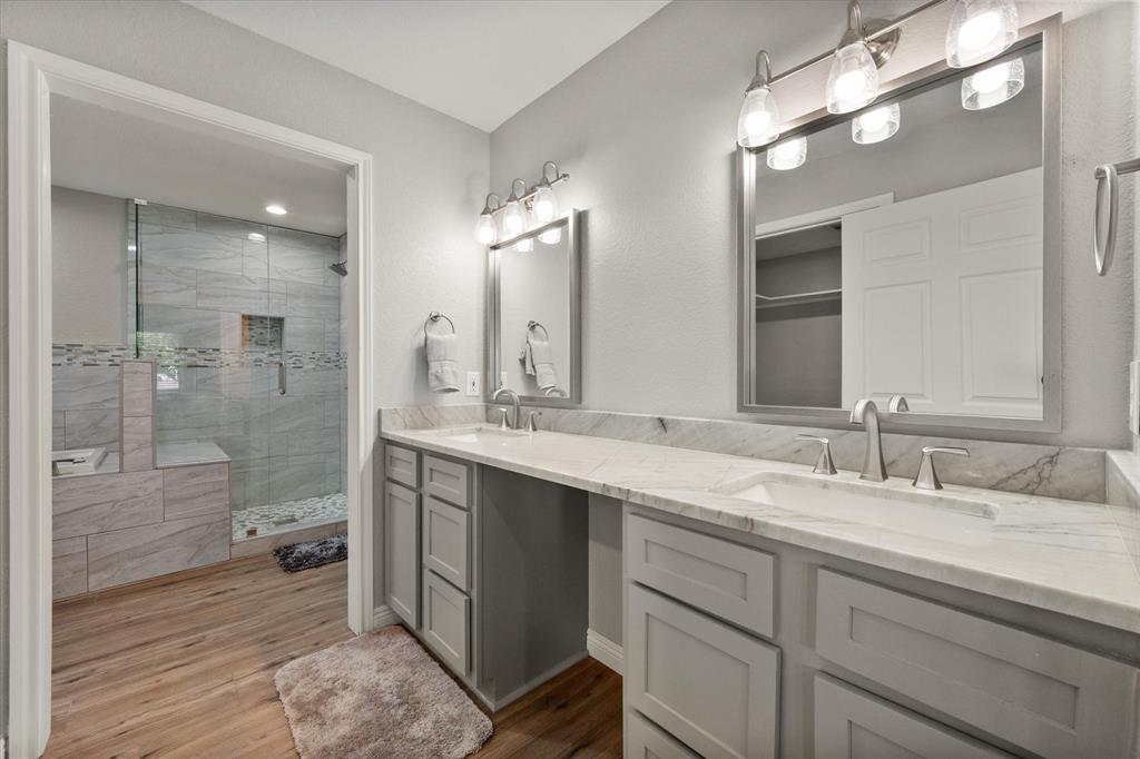 113 Cinch Buckle Ranch Road Trinidad, TX 75163 - Photo 21 of 36 a bathroom with a double vanity sink mirror and shower