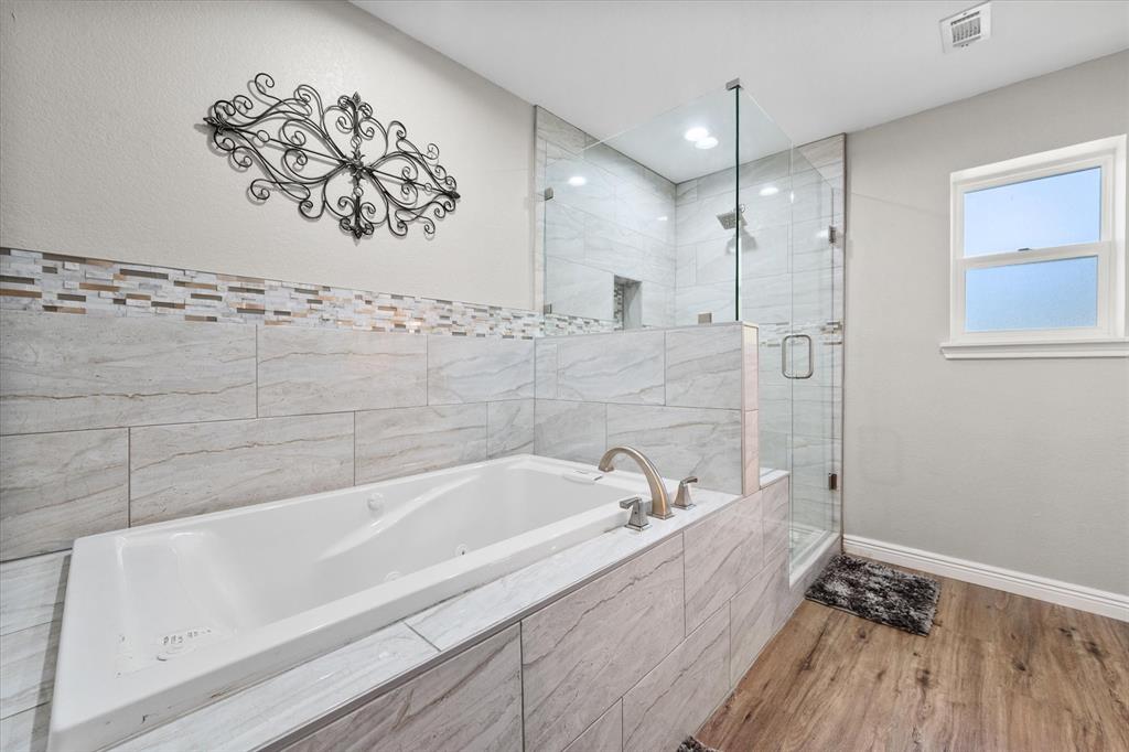 113 Cinch Buckle Ranch Road Trinidad, TX 75163 - Photo 22 of 36 a bathroom with a bathtub and a shower