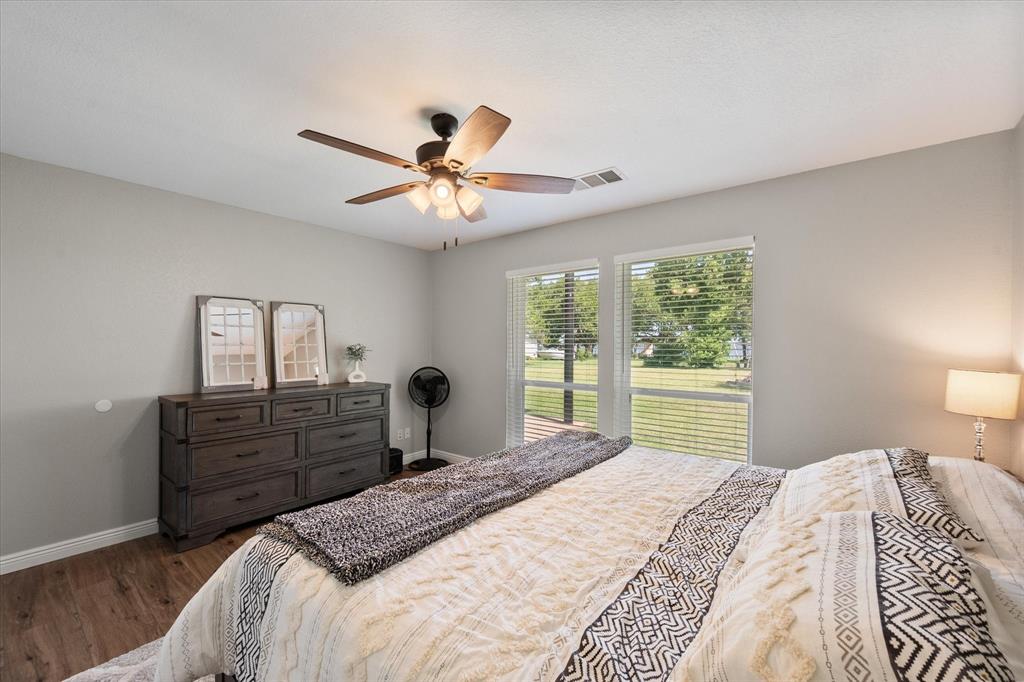 113 Cinch Buckle Ranch Road Trinidad, TX 75163 - Photo 25 of 36 a bedroom with a bed dresser and a window