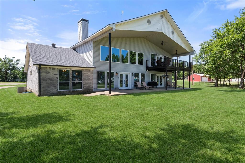 113 Cinch Buckle Ranch Road Trinidad, TX 75163 - Photo 34 of 36 a view of a house with a swimming pool