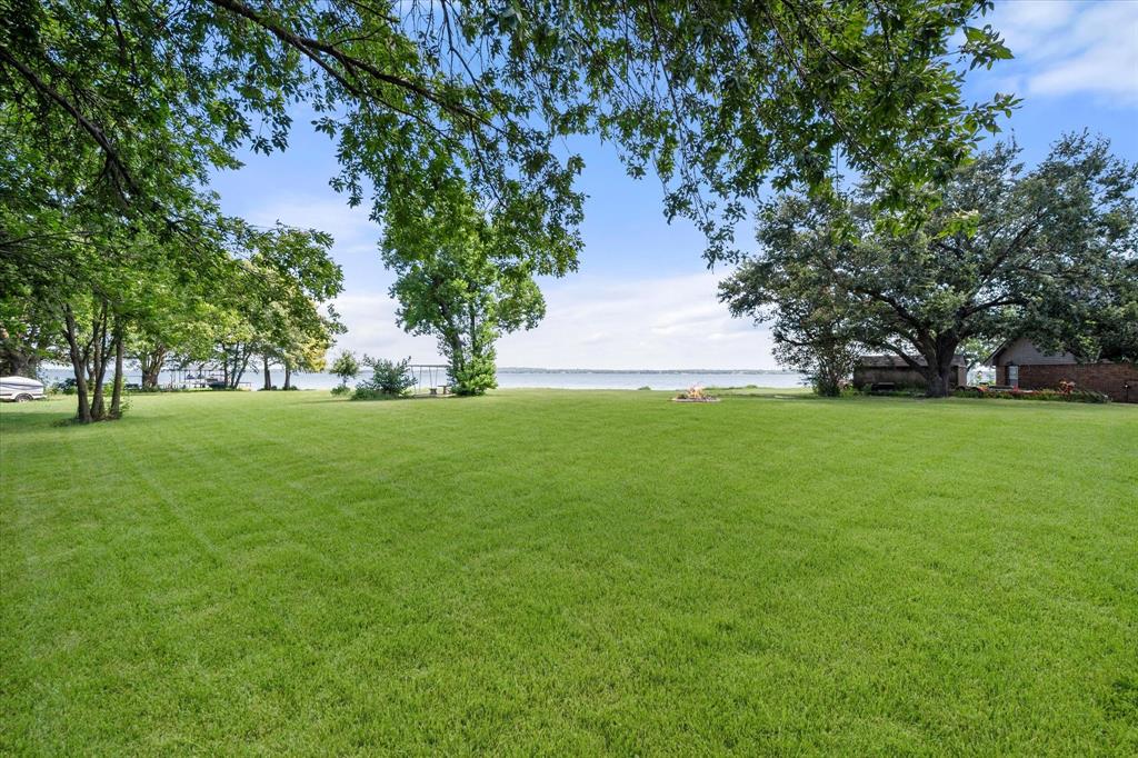 113 Cinch Buckle Ranch Road Trinidad, TX 75163 - Photo 35 of 36 a view of green field with trees