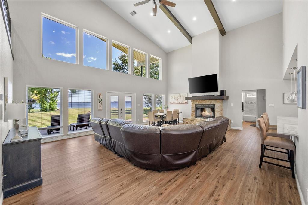 113 Cinch Buckle Ranch Road Trinidad, TX 75163 - Photo 7 of 36 a living room with fireplace furniture and a flat screen tv