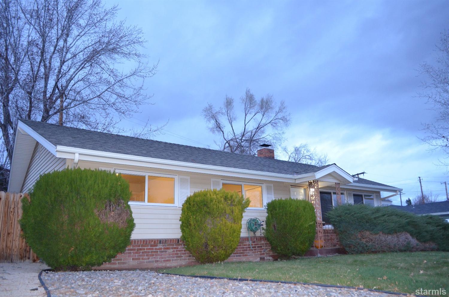 1095 Kings Row Reno, NV 89503 - Photo 11 of 23 a front view of a house with garden