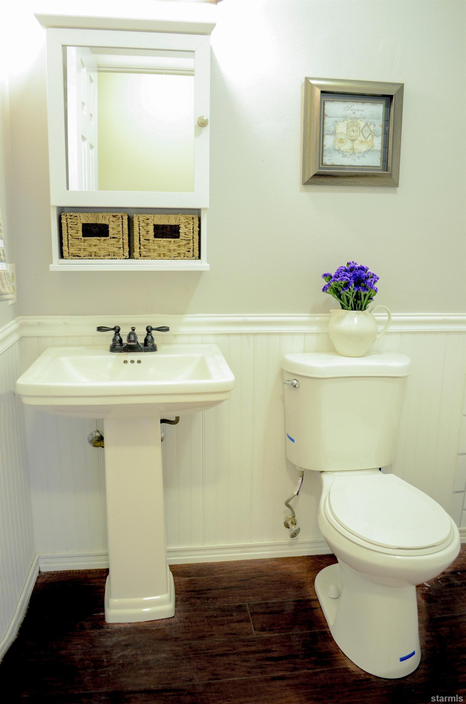 1095 Kings Row Reno, NV 89503 - Photo 17 of 23 a bathroom with a sink toilet and a mirror