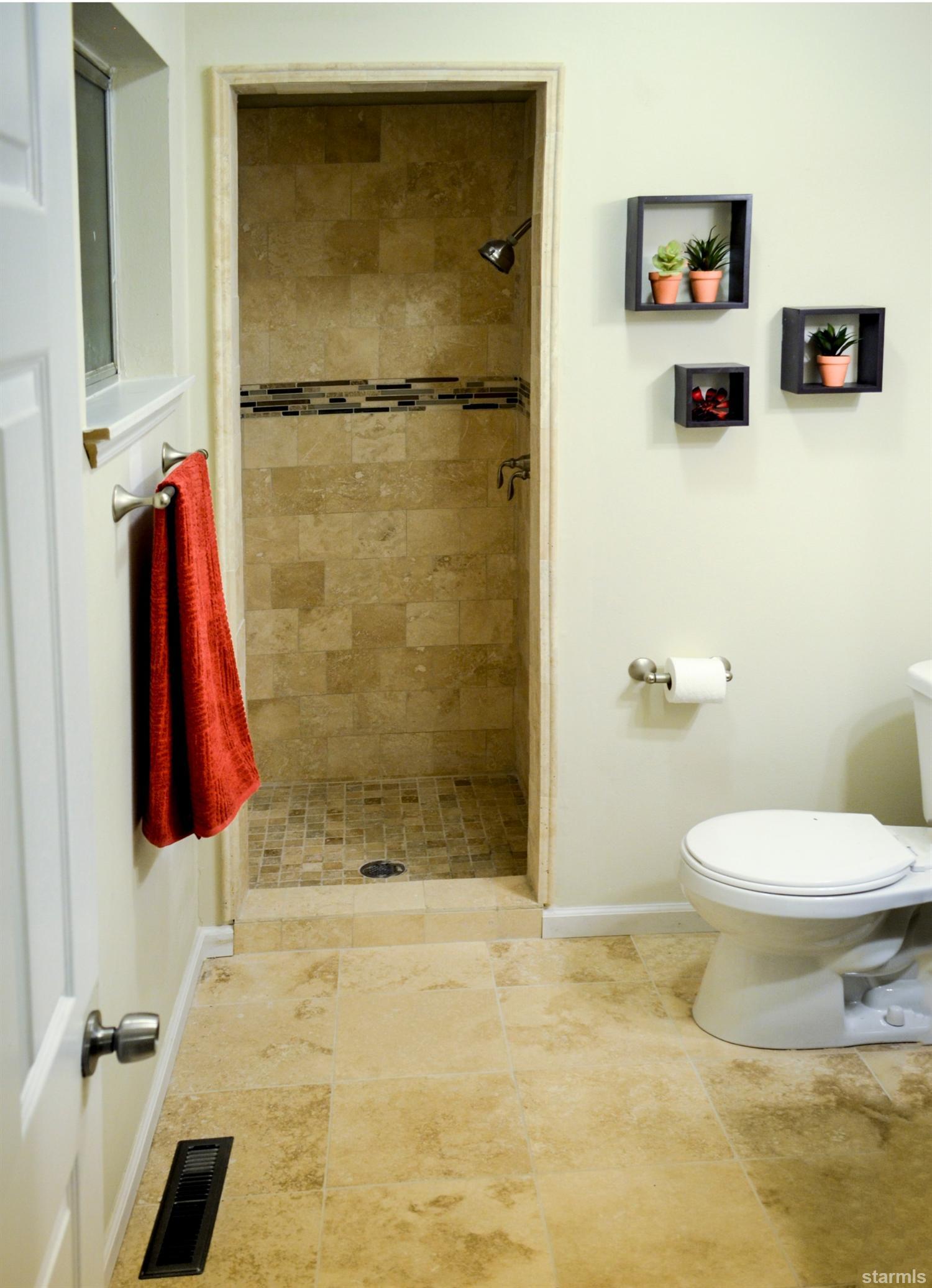 1095 Kings Row Reno, NV 89503 - Photo 22 of 23 a bathroom with a toilet and a shower