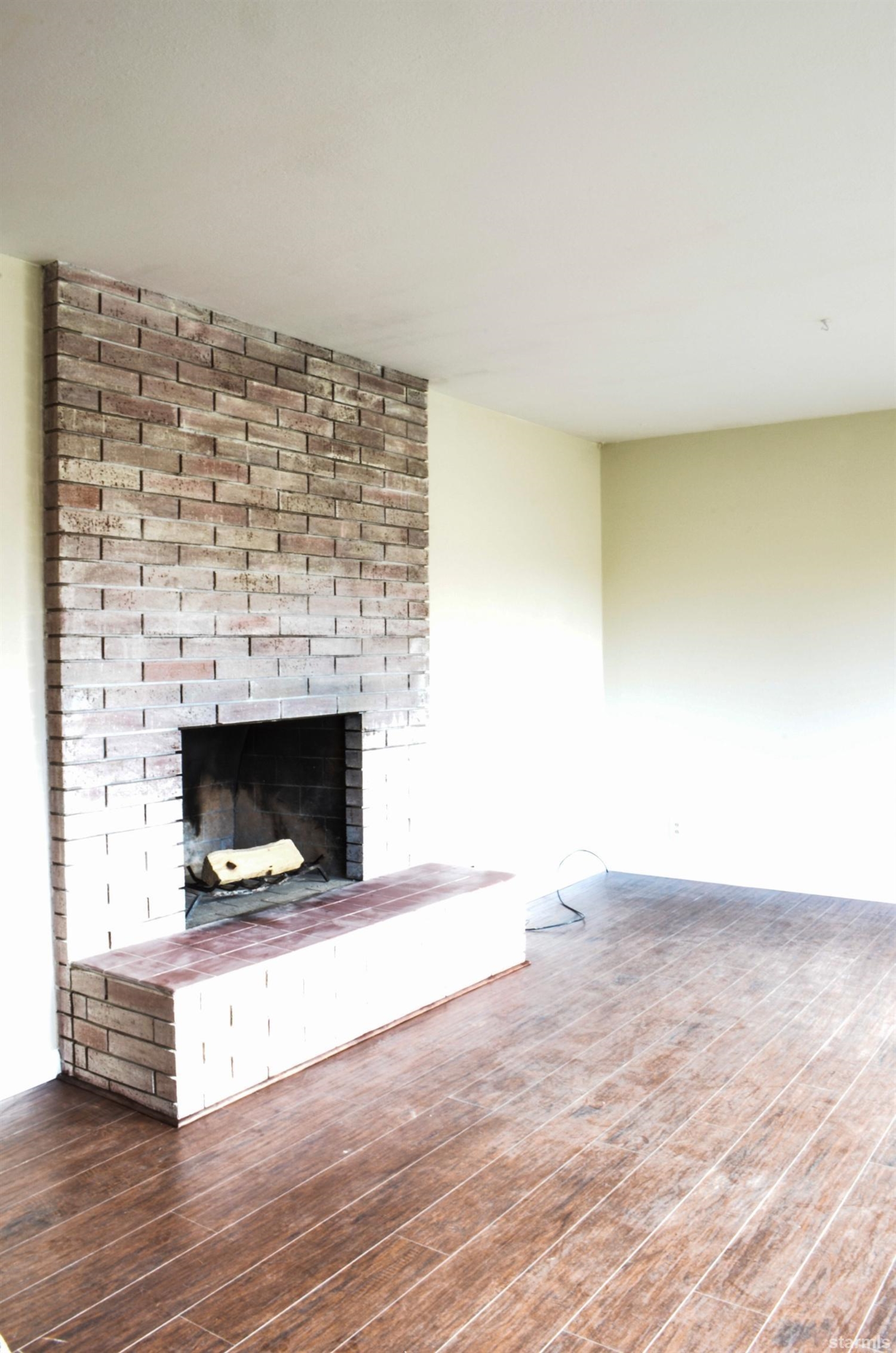 1095 Kings Row Reno, NV 89503 - Photo 4 of 23 a living room with a fireplace
