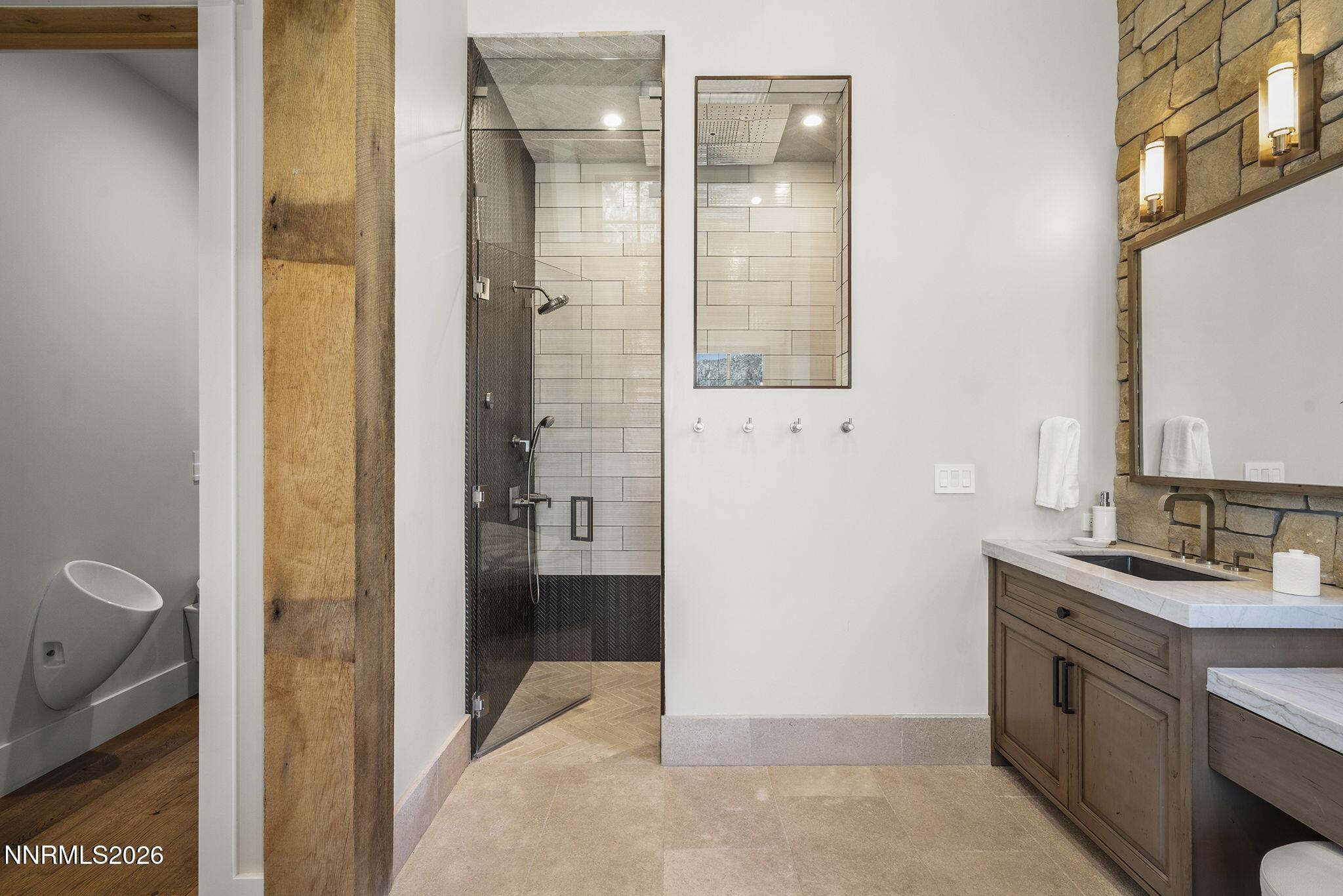 3513 Cutoff Trail Carson City, NV 89705 - Photo 26 of 43 a bathroom with a granite countertop sink a mirror and a shower