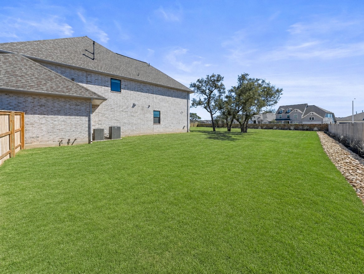 1440 Riva Ridge Drive Leander, TX 78641 - Photo 32 of 37 A meticulously maintained lawn offers generous outdoor space for recreation and relaxation.