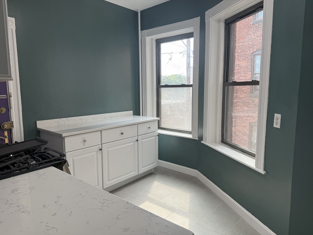 36 Orkney Road, Unit 3 Boston, MA 02135 - Photo 6 of 11 a view of a kitchen with window