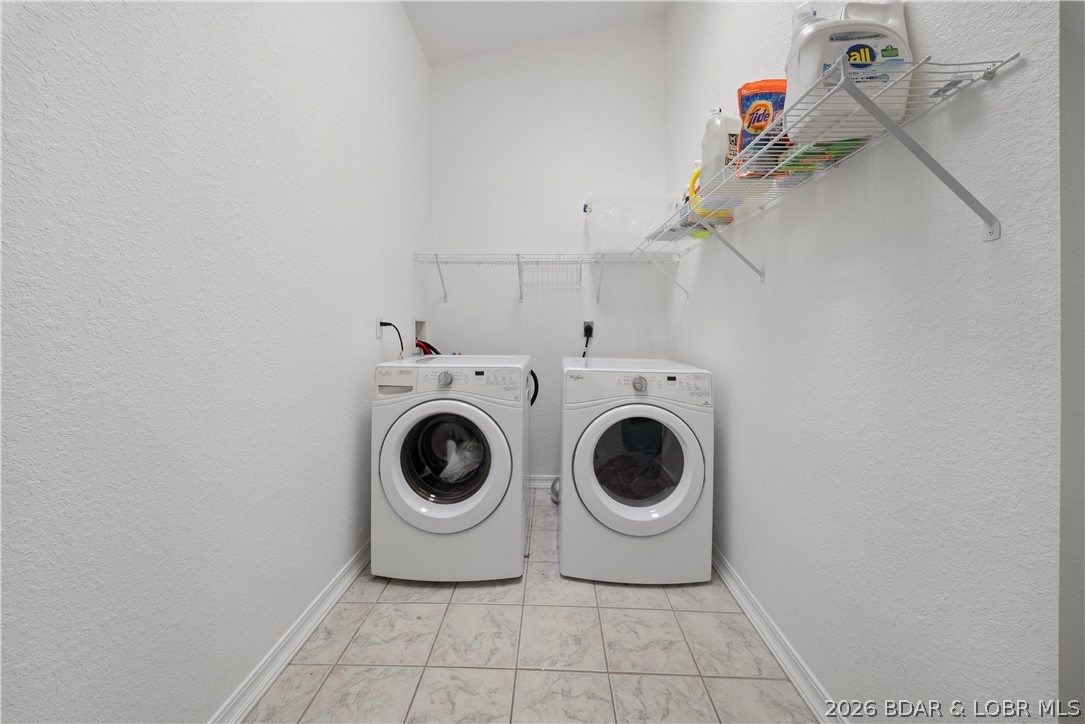 2247 Breezy Acres Road Osage Beach, MO 65065 - Photo 23 of 53 Washer & Dryer on Main Level in large laundry room