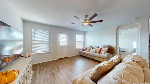 a living room with furniture and a flat screen tv