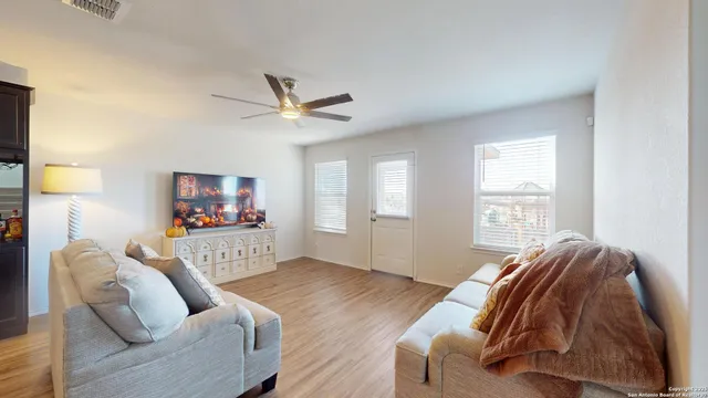a bedroom with furniture and a window