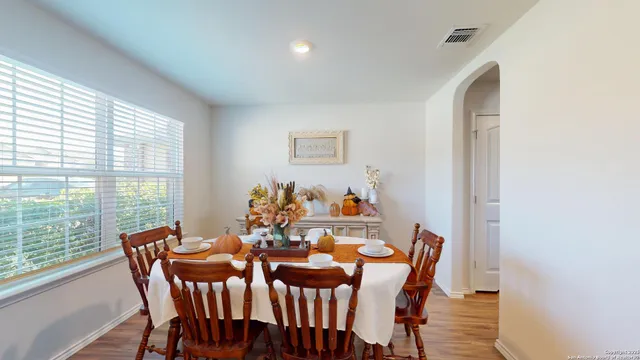 a view of a dining room with furniture window and outside view