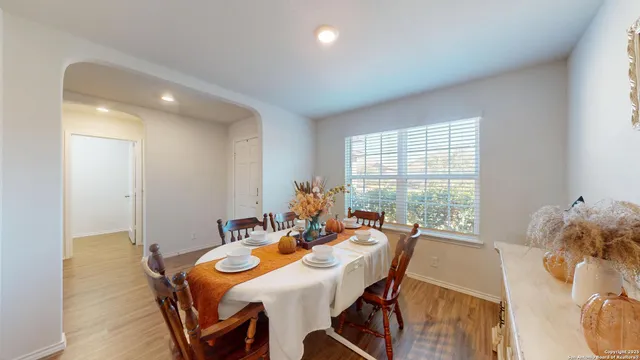 a view of a dining room with furniture window and outside view