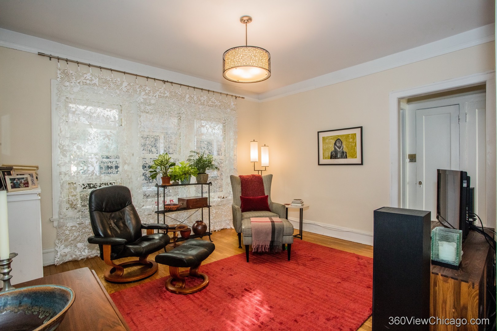 546 West Brompton Avenue, Unit 2S Chicago, IL 60657 - Photo 13 of 17 a room with furniture or wooden floor and a large window