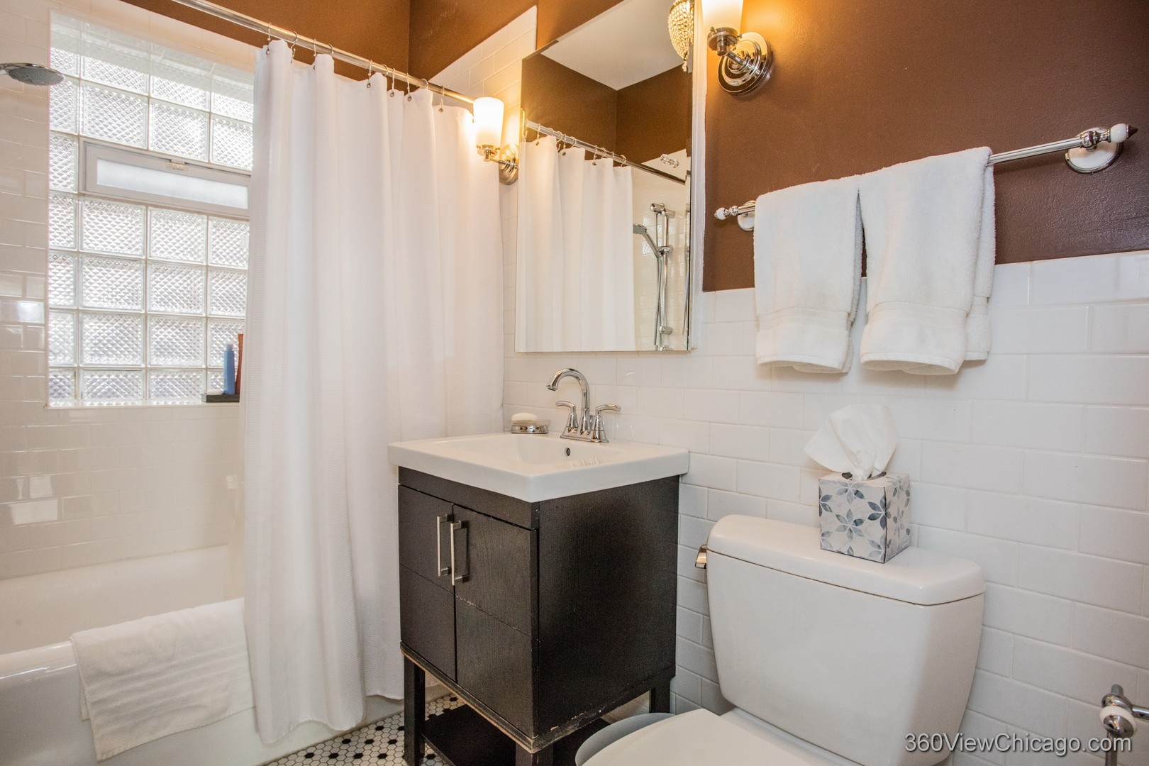 546 West Brompton Avenue, Unit 2S Chicago, IL 60657 - Photo 15 of 17 a bathroom with a sink toilet and shower