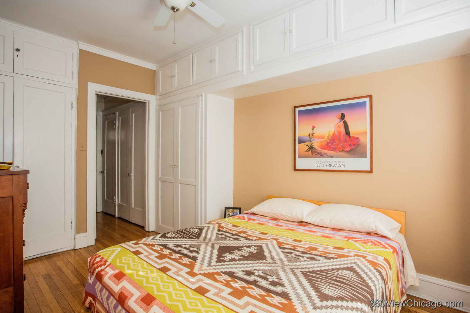 546 West Brompton Avenue, Unit 2S Chicago, IL 60657 - Photo 16 of 17 a bedroom with a bed and a painting on the wall