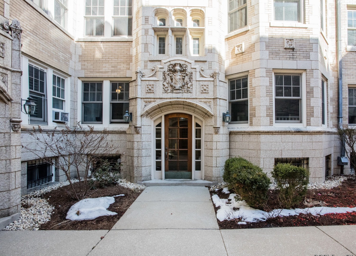 546 West Brompton Avenue, Unit 2S Chicago, IL 60657 - Photo 3 of 17 a front view of a building with a garden and entryway