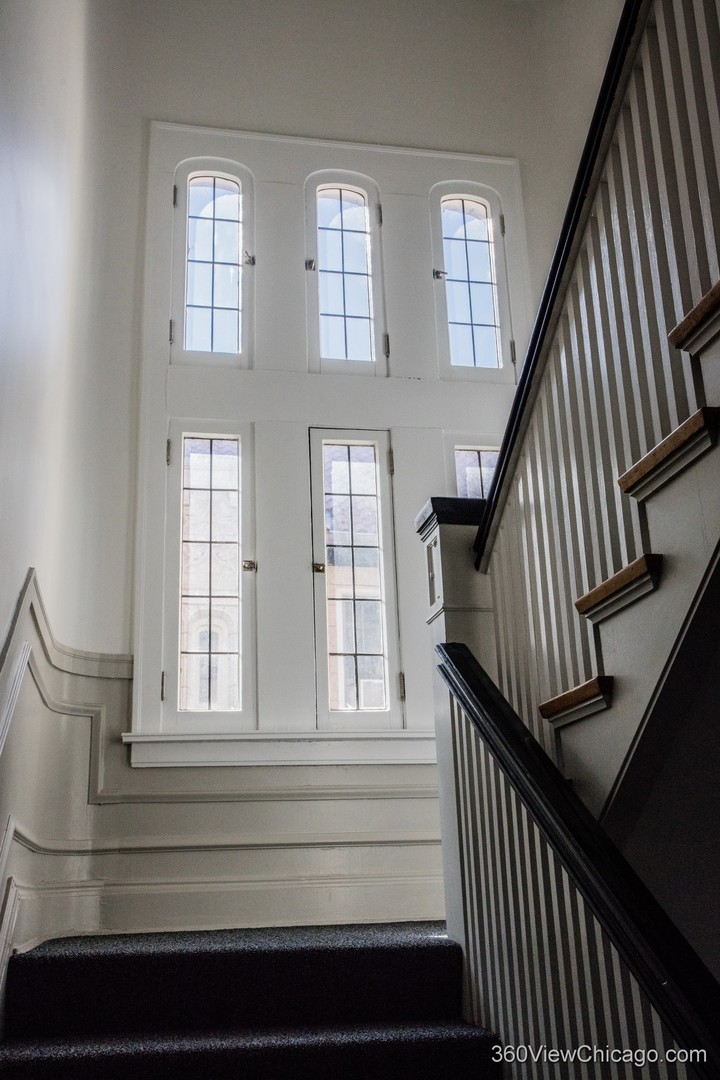 546 West Brompton Avenue, Unit 2S Chicago, IL 60657 - Photo 4 of 17 a view of staircase with large window