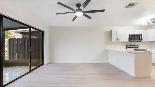 a view of a kitchen with a sink and dishwasher