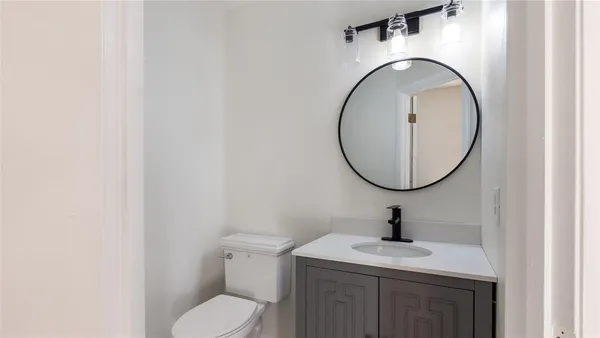 a bathroom with a toilet and a sink