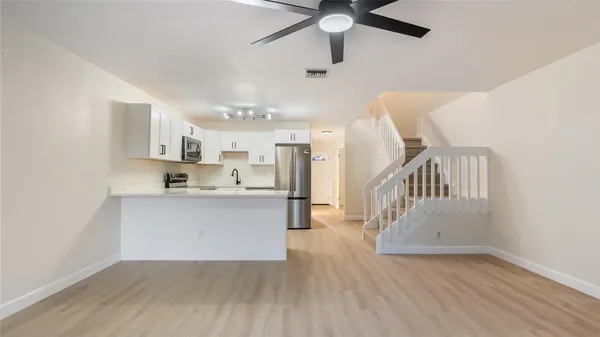 a view of kitchen and kitchen with wooden floor